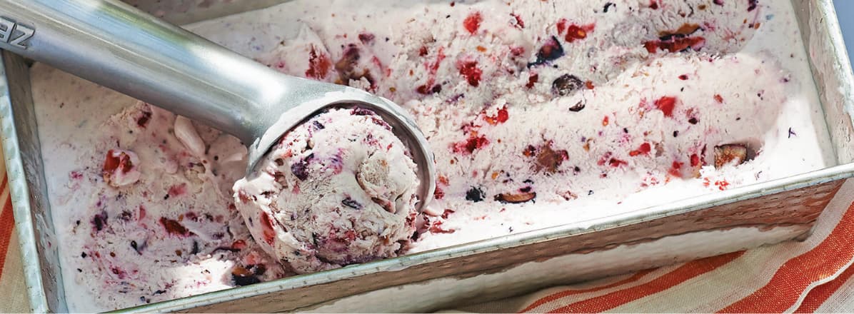 Overhead shot of three-ingredient berry ice cream with scoop in container