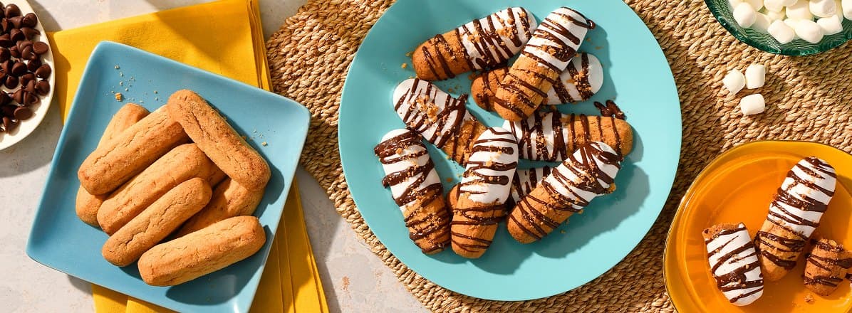 Overhead shot of Cinnamon Churro Dunkers topped with marshmallow fluff and drizzled with chocolate.