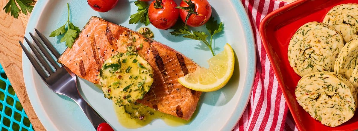 Overhead shot of Sockeye salmon with cowboy butter melting, and topped with fresh cilantro
