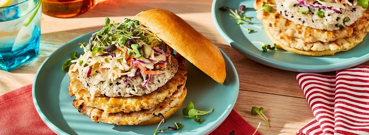 Japanese-style chicken smashed burger with two patties and rice patty on top.