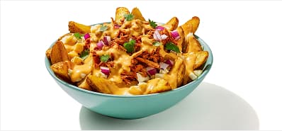 Potato wedges topped with cheese curds, queso, al pastor, red onion, and cilantro.