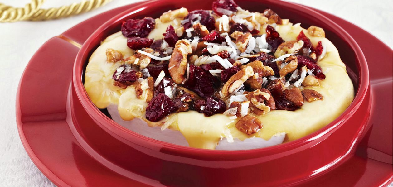 Warm Brie Topped with  Dried Fruit, Pecans & Coconut