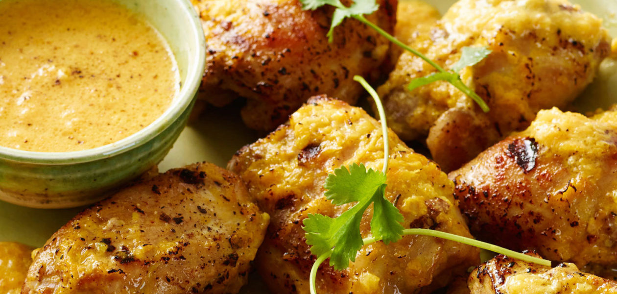 Grilled Chicken Thighs with Curried Peach Sauce