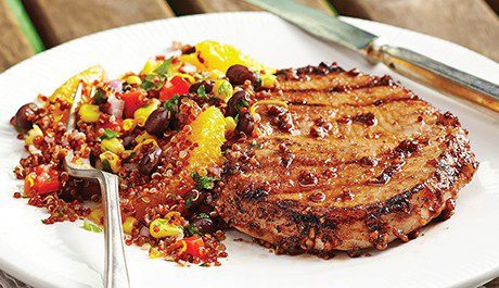 Grilled pork chops with orange & black bean quinoa salad