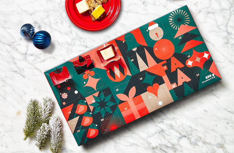 Decorative rectangular paper box advent calendar with 24 doors, each containing a portion of artisan cheese.