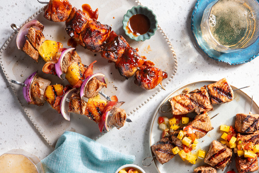 Three kinds of African-inspired kabobs included ground lamb, chicken and beef with crushed peanuts in one dish and lemon wedges off to the side. From the souks of Northern Africa to the earthy spices of the south, Africa has a whole continent of fabulous skewer flavour pairings ready for your grill.