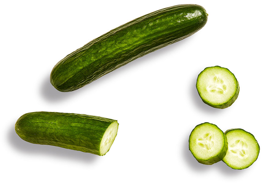 Green English cucumber on a white background.