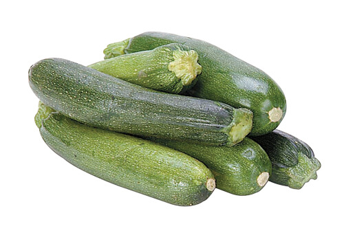 Bunch of zucchinis on a white background.