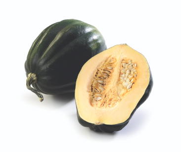 Whole acorn squash on its side, with an extra half acorn squash, centre facing out leaning against it on white background.
