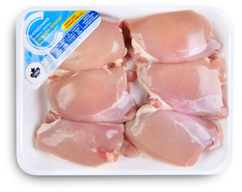 Value package of chicken thighs in a tray with a blue Compliments label.