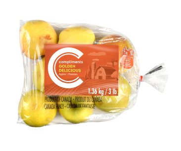 Clear bag of Compliments Golden Delicious Apple with orange label