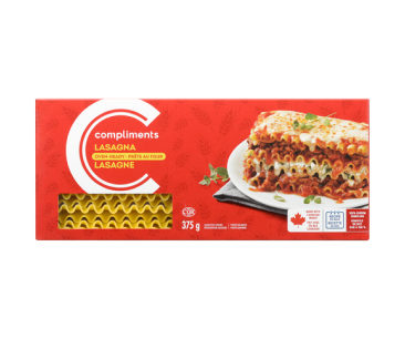 Red cardboard box of Compliments Oven-Ready Lasagna noodles with image of a slice of layered lasagna.