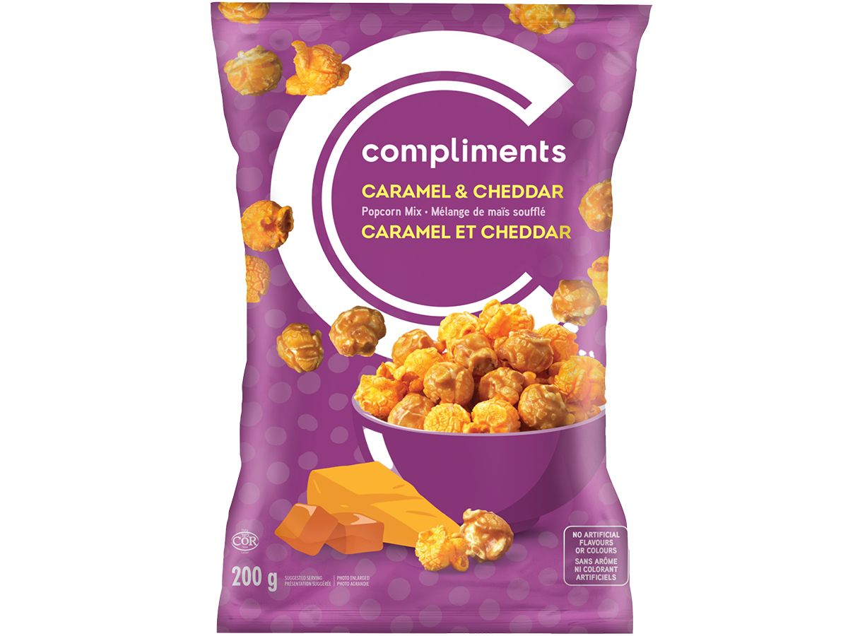 Purple Compliments bag of Compliments Cheddar and Caramel Popcorn sitting in a purple bowl on package.
