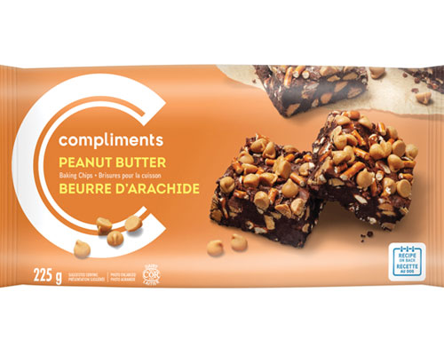 Orange coloured package of Compliments Peanut Butter Baking Chips with a photograph on package of a stack of chocolate squares studded with the peanut butter chips.
