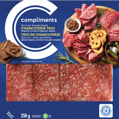 Clear plastic package of Compliments Charcuterie Trio (Hungarian, Cervelat and Peppercorn) with blue label.