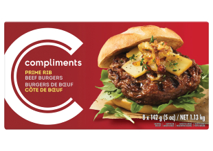 A burgundy box of Compliments Prime Rib Beef Burgers with a photograph of a dressed burger on the front of the package.