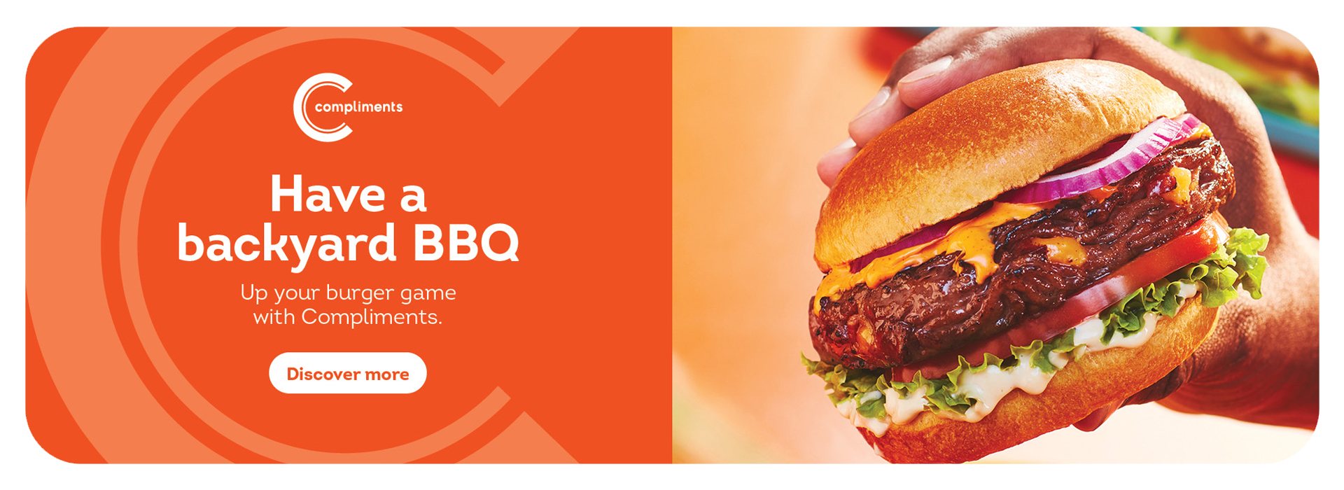 Text Reading "Have a Backyard BBQ. Up your burger game with Compliments.Click on 'Discover More' Button to learn more" On the right side, a hand is shown holding a large hamburger.